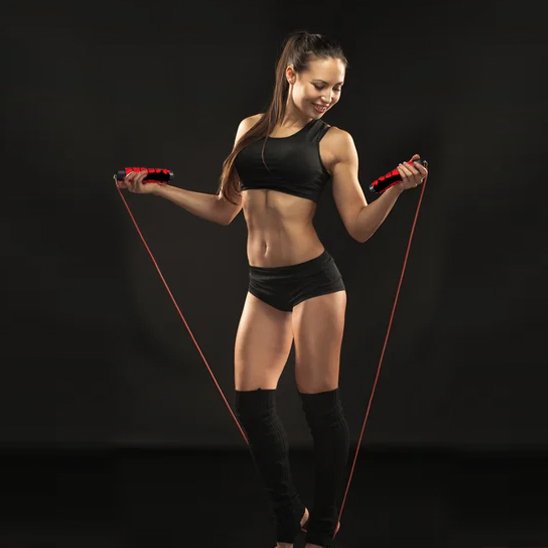Corde à sauter sport femme pose avec la corde regarde en bas