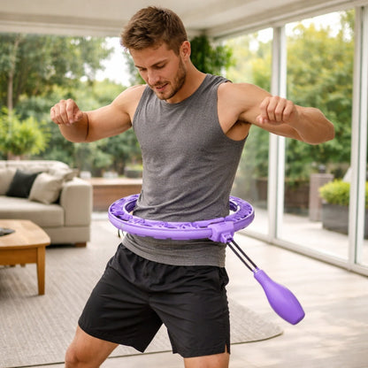 Hula hoop un jeune homme pratique à la maison