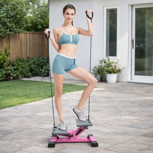Mini stepper double amortisseurs femme exercice avec élastiques dans un jardin