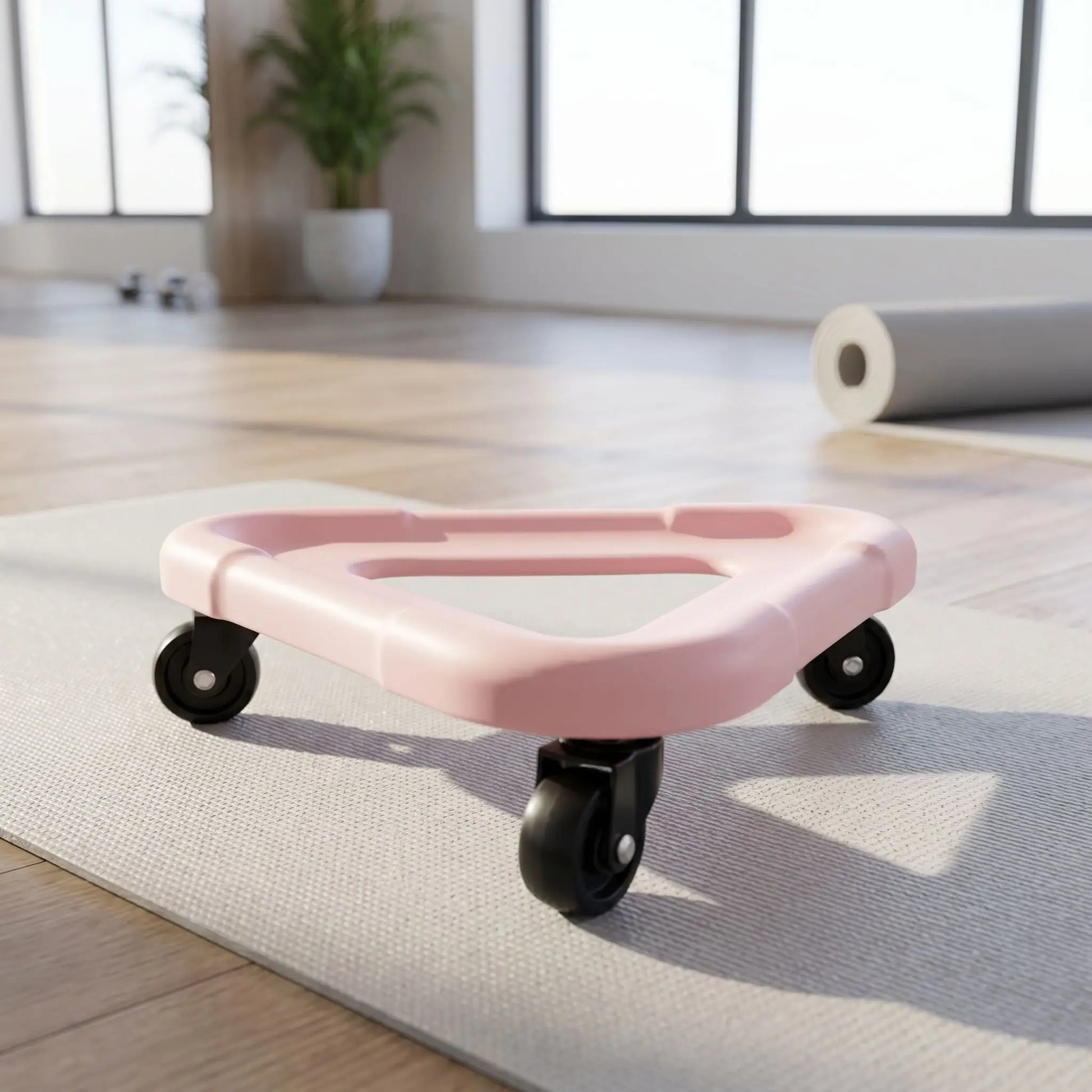 Roue abdo modèle de couleur rose sur un tapis de gym