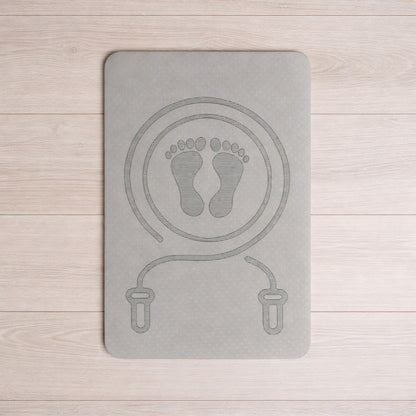 Tapis de sport de couleur gris sur le plancher